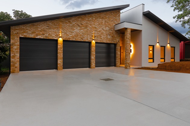 Spacious concrete multi-car driveway accommodating several vehicles